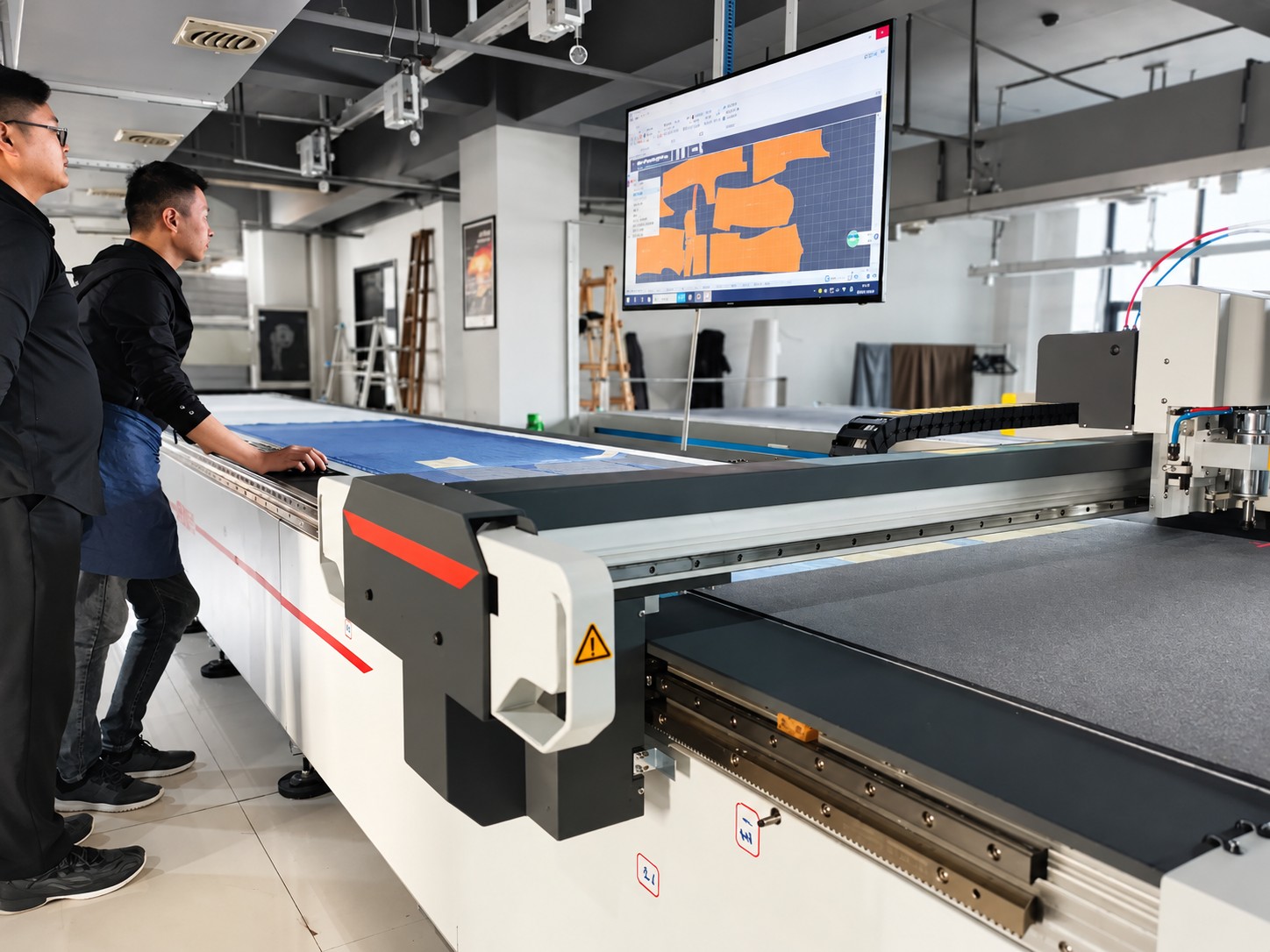 Fabric cutting equipment at work
