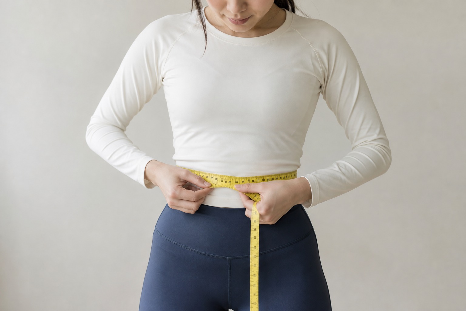 Waist measurement demonstration with a tailor tape